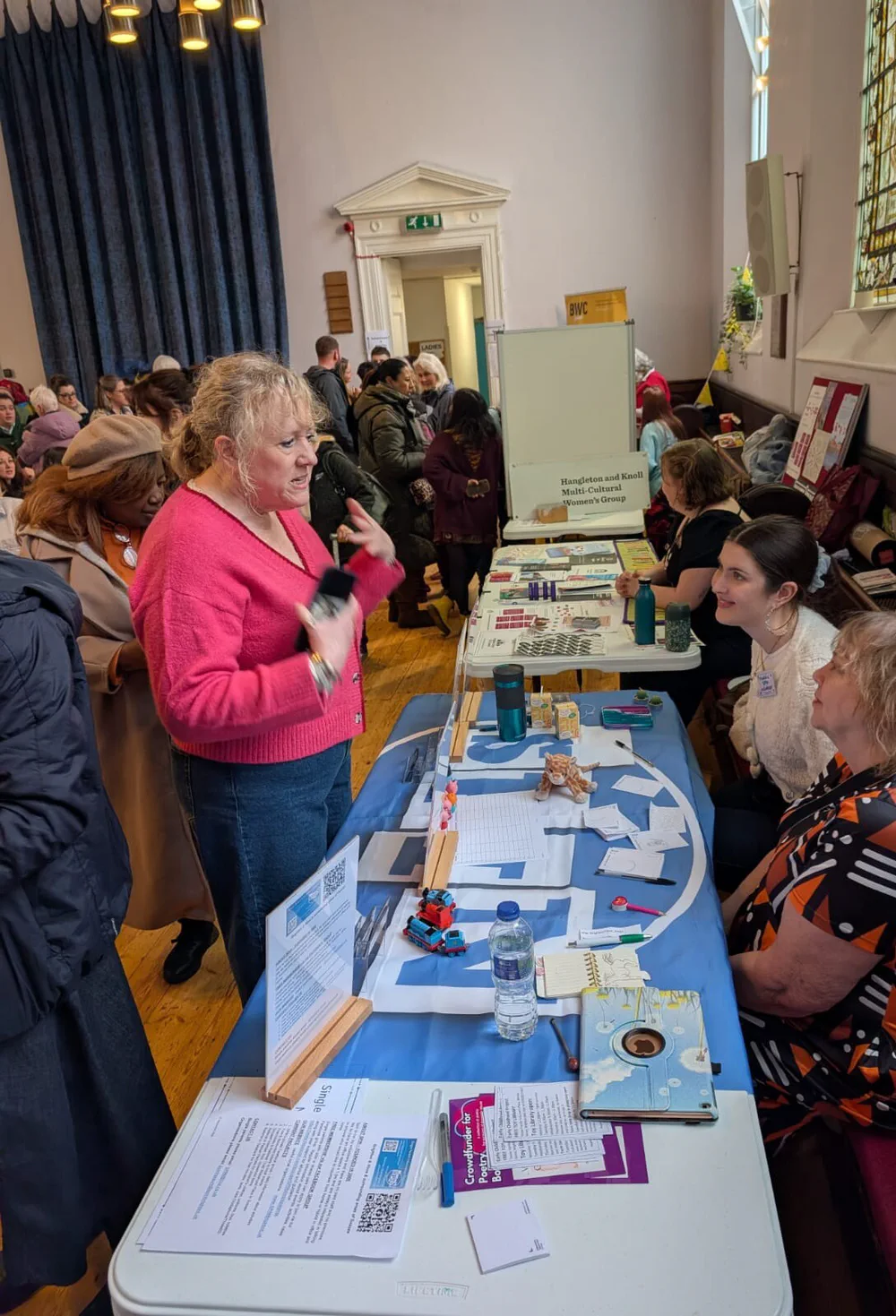 Two SPIN volunteers at the SPIN stall